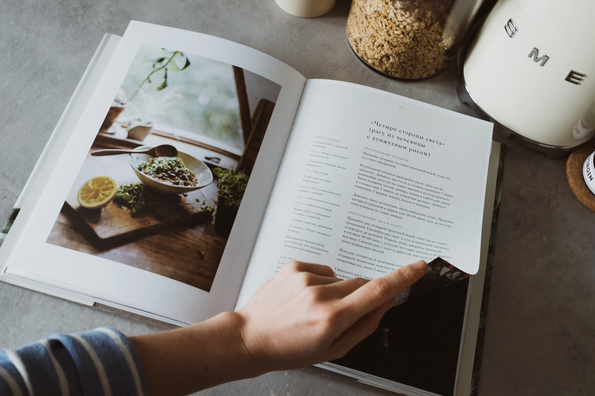 Homemaker Looking Through Recipe Book